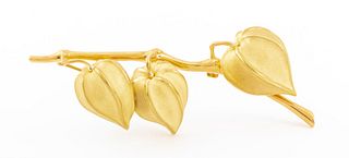 Tiffany & Company 18K yellow gold gooseberry brooch or pin, brightly polished and sandblast finished, designed as three cape gooseberries suspended fr