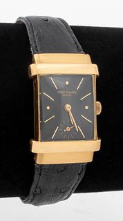 Vintage Patek Philippe Top Hat 18K yellow gold watch, Reference number 1450, triple signed, designed with rectangular case and acrylic crystal, featur