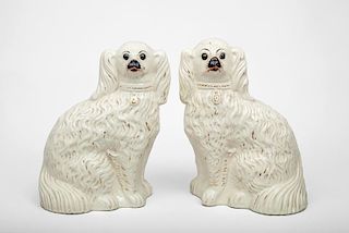 Pair of Modern White-Glazed Staffordshire Pottery Figures of Seated Spaniels