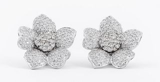 Vintage 18K white gold and diamond floral clip earrings with curved petals and flower form, set with approx. 378 round brilliant cut diamonds, approx 