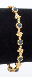 18K yellow gold blue sapphire and diamond bracelet, brightly polished, featuring 10 round bezel set blue sapphires weighing a total of approx. 8.0 car