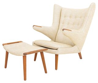 Modernica Los Angeles "Papa Bear" linen tufted upholstered walnut arm chair and footstool, marked "Modernica Los Angeles" to the underside of the foot
