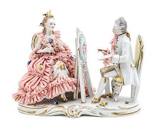 A German Porcelain Figural Group, Height 7 1/4 x width 9 1/4 x depth 4 1/4 inches.