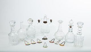 Nine Assorted Glass Decanters and Stoppers and Nine Liquor Labels