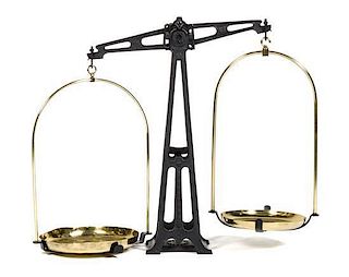 A Cast Iron and Brass Balance Scale, Height 23 3/8 x width 28 x depth 5 1/4 inches.