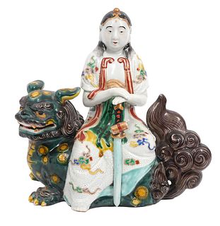 Chinese Porcelain Figure Seated on Foo Dog