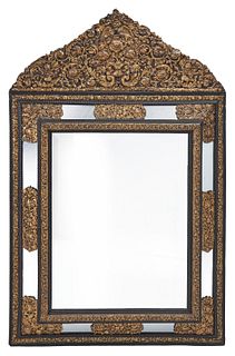 A Flemish-style repousse wall mirror