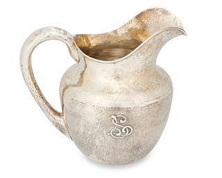 Clemens Friedell (1872-1963), An Arts & Crafts hammered sterling silver pitcher, early 20th century