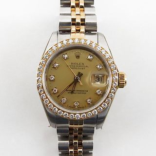 Lady's Rolex DateJust Two Tone Stainless Steel and 14 Karat Yellow Gold Automatic Movement Watch with Diamond Hour Markers an