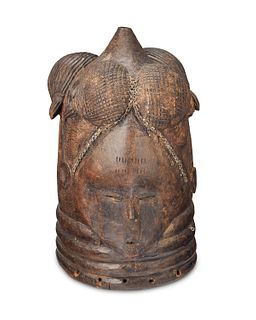 An Mende "Ndoli Jowei" carved wood helmet mask