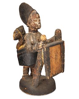 A Yoruba carved wood maternity altarpiece