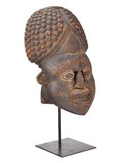 A Bamum "Tu-Ngunga" carved wood helmet mask