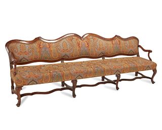 A French Louis XV-style Provincial sofa