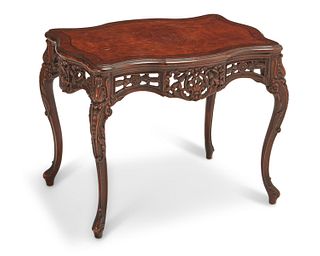 An Italian carved wood occasional table