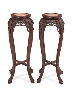 A pair of Chinese carved wood lamp stands