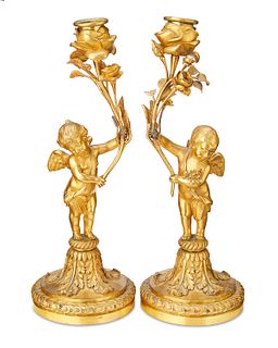 A pair of French Henry Dasson-style gilt-bronze candlesticks, Late 19th century