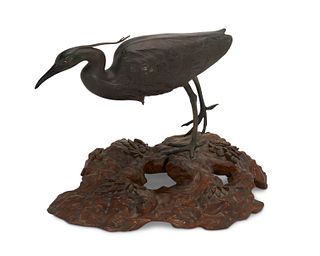 A Japanese bronze and wood egret sculpture
