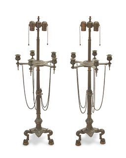 A pair of French Empire-style bronze candlestick lamps