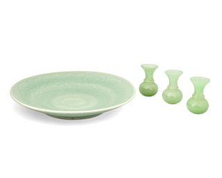 A Chinese celadon earthenware platter with three Peking glass vases