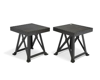 A pair of industrial riveted metal side tables