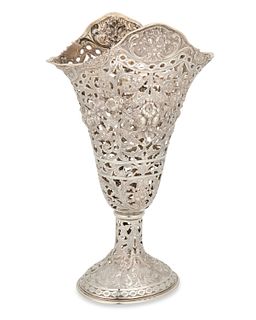 A pierced silver vase
