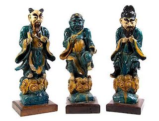 A Set of Three Chinese Polychrome Decorated Figures, Height 25 inches.