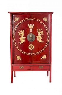 A Chinese Red Lacquered Cabinet, Height 61 1/4 x width 41 1/2 x depth 20 1/2 inches.