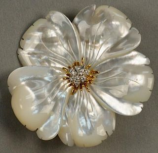 18K and mother of pearl flower brooch, center set with nine diamonds with 18K backing signed K... 
dia. 2 1/8in.