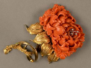 14K gold and coral brooch carved coral in form of large flower set with four small diamonds. 
ht. 3 1/2in., total weight 46.8