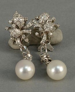 18K white gold drop earrings set with diamonds and one pearl. 
ht. 1 3/4in.