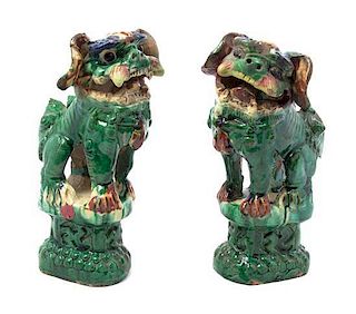 A Pair of Sancai Style Figures of Temple Lions, Height 9 1/2 inches.