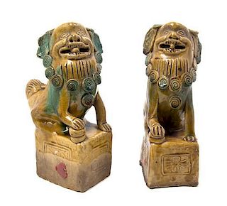 A Pair of Ceramic Figures of Temple Lions, Height 8 1/4 inches.