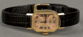 Baum & Mercier 14K gold ladies wristwatch.