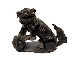 A Chinese Cast Metal Temple Lion, Width 5 1/4 inches.