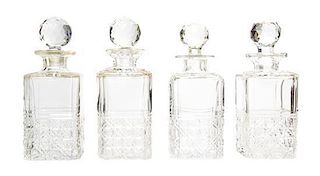 A Set of Four Cut Glass Decanters, Height 9 1/2 inches.
