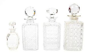 A Group of Four Cut Glass Decanters, Height of set 8 3/4 inches.