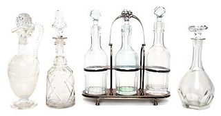 A Collection of Cut and Etched Glass Decanters, Height of tallest 13 3/4 inches.