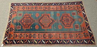 Caucasian Oriental area rug, late 19th century. 
(some wear) 
5'4" x 8'5"