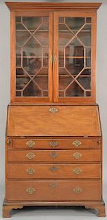 George II mahogany secretary desk in two parts, upper portion with cornice molding over glazed doors on lower section with sl