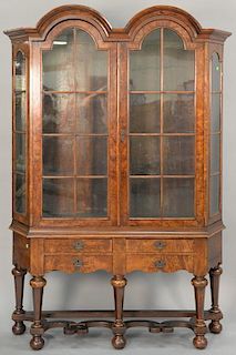 Dutch burlwood cupboard in two parts, upper section having double arched top over two arched glazed doors flanked by arch top