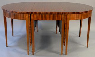 Custom mahogany Federal style three part dining table having central drop leaf table and two demilune ends all set on square 