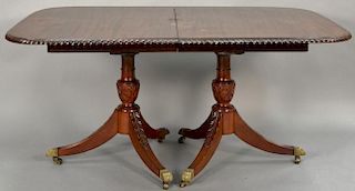 Fineberg mahogany dining table with carved rope edge on double pedestal base with two 18 inch leaves and custom pads. 
ht. 29