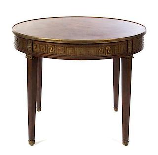 A Neoclassical Style Mahogany Dining Table, Height 30 x diameter 41 inches.