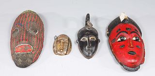 Group of Four Carved Tribal Masks
