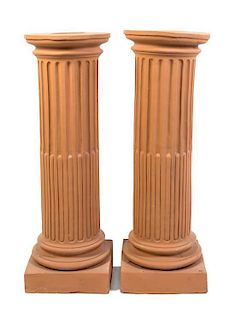 A Pair of Ceramic Pedestals, Height 38 inches.