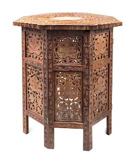 A Middle Eastern Bone Inset Hardwood Occasional Table, Height 22 1/4 x diameter 21 3/4 inches.