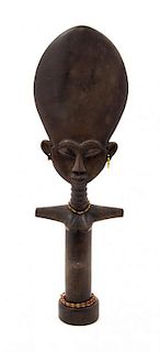 A Carved African Figure, Height 12 inches.