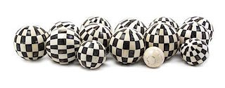 A Collection of Bone and Ebony Veneered Balls, Diameter of first 4 inches.
