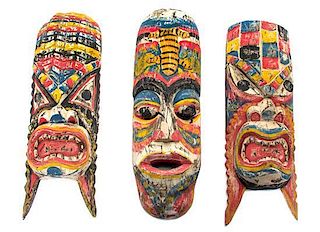A Collection of Six Polychrome Decorated Masks, Height of tallest 20 inches.