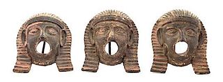 A Set of Three Egyptian Style Iron Masks, Height 6 3/4 inches.